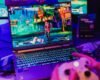 Colorful gaming scene on a laptop with controller, perfect for entertainment visuals.